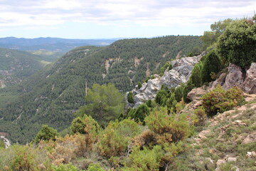 Fototapeta premium Mountains of El Maestrazgo, Castellón, Spain, rugged, rocky, colorful, and with trees