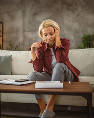 Mature senior woman work from home and have headache pain