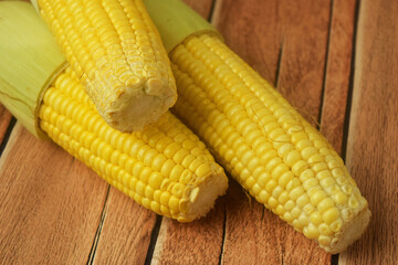 Closeup shot of some peeled corn on a wooden table