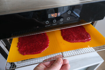 Preparation of a fruit leather, from blended and dehydrated raspberries.