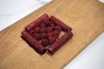 Preparation of a fruit leather, from blended and dehydrated raspberries.