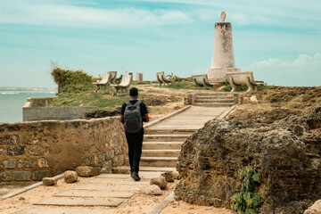 Rear view of a man standing at The Vasco Da Gama Pillar - A history monument in Malindi Town  in...