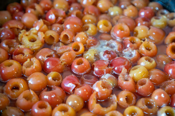 Boiling begonia fruits in the pot