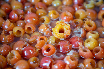 Boiling begonia fruits in the pot