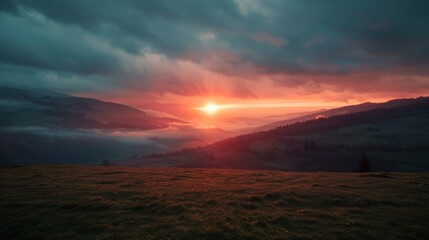 Vast field with wildflowers, rolling hills, and a mountain range under a blue sky with scattered clouds.