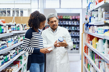 Pharmacist, customer or help in shop with medicine, shopping with professional support. Pharmacy, people or together for healthcare service with advice for dosage, pill information for woman with flu