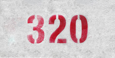 Red Number 320 on the white wall. Spray paint.