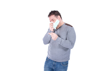 Fototapeta premium A man in a protective mask takes care of his health. White background.