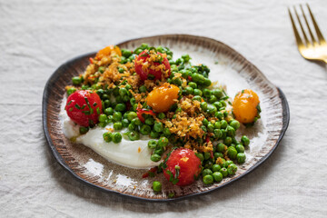 Burrata cheese with grilled green peas, pickled tomatoes and breadcrumbs