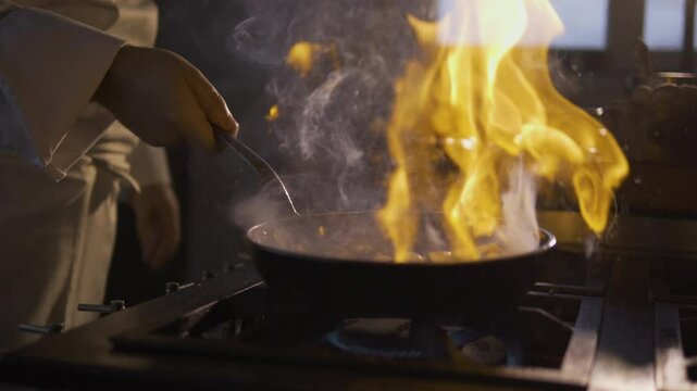 Chef preparing delicious escargot dish