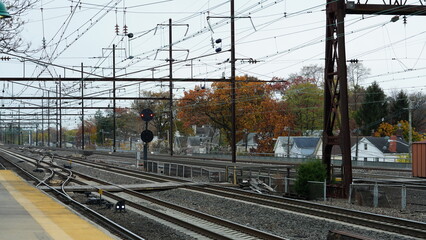 Naklejka premium The train station view with the iron tracks near the platform
