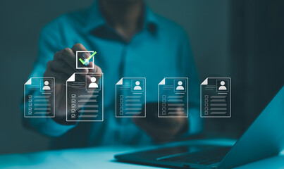 Human Resource Concept. A businessman or HR manager interacting with digital icons of employee...