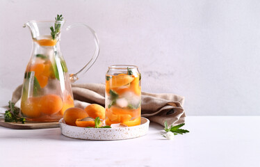 summer drink apricot lemonade with ice and mint