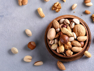 nuts mix in a wooden bowl on the table