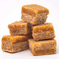 Creamy, crumbly and decadent fudge tasty, sweet, dessert, treat, confectionery, indulgent. On a white isolated background with copy space.