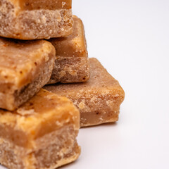 Creamy, crumbly and decadent fudge tasty, sweet, dessert, treat, confectionery, indulgent. On a white isolated background with copy space.