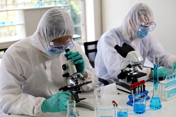 Scientists man are developing medicines to cure diseases.
