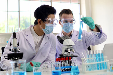Scientists man are developing medicines to cure diseases.