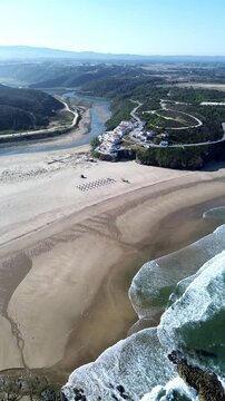 Praia de Odeceixe beach in Algarve aerial vertical shot. Southwest Alentejo and Vicentine Coast, Portugal