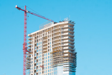 Construction Crane at Building Site - Concept of Modern Construction