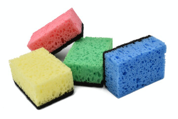 Several dishwashing sponges of different colors lie on a white background.