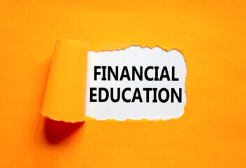 Financial education symbol. Concept words Financial education on beautiful white paper. Beautiful orange paper background. Business Financial education concept. Copy space.