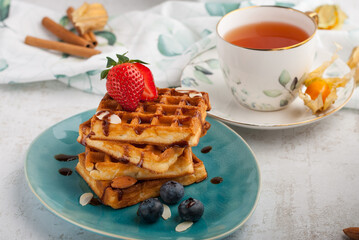 Belgian waffles with chocolate and fruit