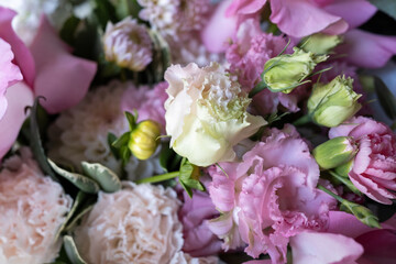 Beautiful bouquet and different flowers on a light background. Flower petals. Floral wallpaper. Pattern of fresh flowers. Floral design of a postcard with a light vintage effect