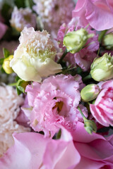 Beautiful bouquet and different flowers on a light background. Flower petals. Floral wallpaper. Pattern of fresh flowers. Floral design of a postcard with a light vintage effect