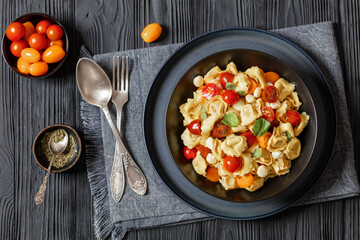 tortellini salad with tomatoes, mozzarella in bowl