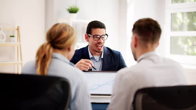 young couple is meeting with a financial planner