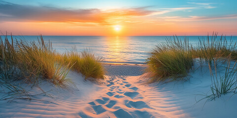 Golden sand dunes leading down to a calm and serene beach at sunrise