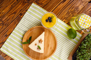 Homemade vanilla cheesecake with vanilla flower on white background - healthy organic summer dessert pie cheesecake. Cheesecake New York. Side view, copy space for text. Menu, recipe, confectionery