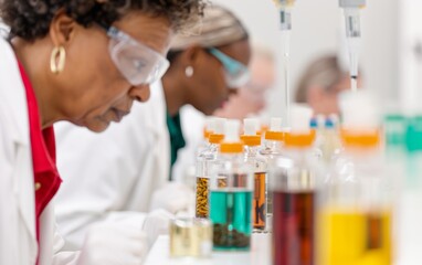 Fototapeta premium Diverse Team of Scientists Conducting Botanical Research in Lab, Examining Plant Extracts for Health Benefits