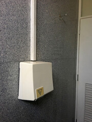 Automatic hand dryer in public toilet.