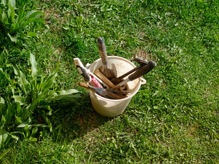 Garden tools are in a bucket