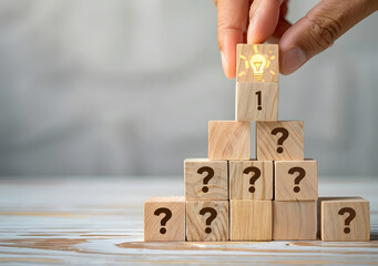 Wooden block with a question mark and light bulb icon. for FAQ. Problem and solution. Quiz, test, survey, support, knowledge, decision, brainstorming, and creative idea design