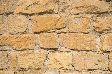 Old wall background with stained aged bricks