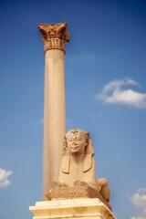 Obraz premium View of Pompey's Pillar against the background of a blue sky. Alexandria, Egypt