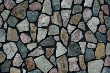 fence real stone wall surface with cement as background. Pattern Vintage Color Texture of Modern Style Design Decorative Uneven Cracked Real Stone Wall Surface with Cement for Construction Work