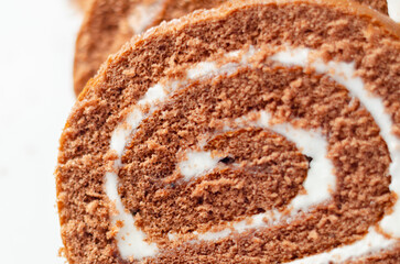 A slice of chocolate cake with white frosting