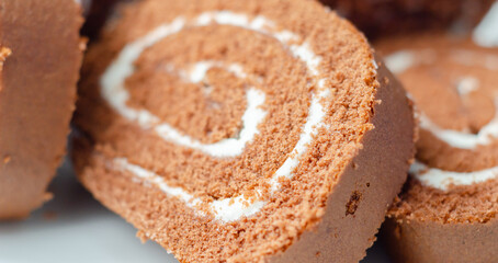 A slice of chocolate cake with white frosting