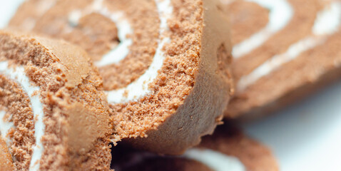 A slice of chocolate cake with white frosting