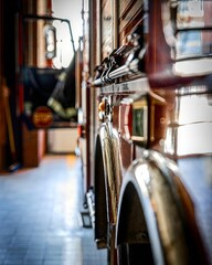 Vertical close-up view of a fire truck inside a fire station with a selective focus on its details.