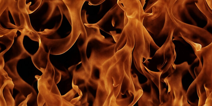 Tanzende Flammen: Lebendige orange Flammen in dynamischer Bewegung, die ein kraftvolles visuelles Spektakel vor einem schwarzen Hintergrund bieten