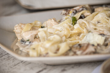 Delicious tagliatelle served on a ceramic plate
