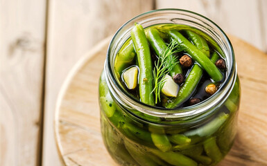 Canned green beans in a glass jar on the table. Top view.Canning vegetables