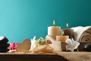 Body and mind wellness with products and blue-green isolated background