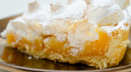 A slice of pie with a lot of powdered sugar on top