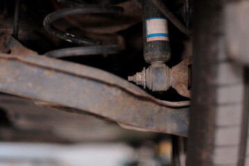 Close-up of Rusty Car Suspension System for Automotive Repair and Maintenance